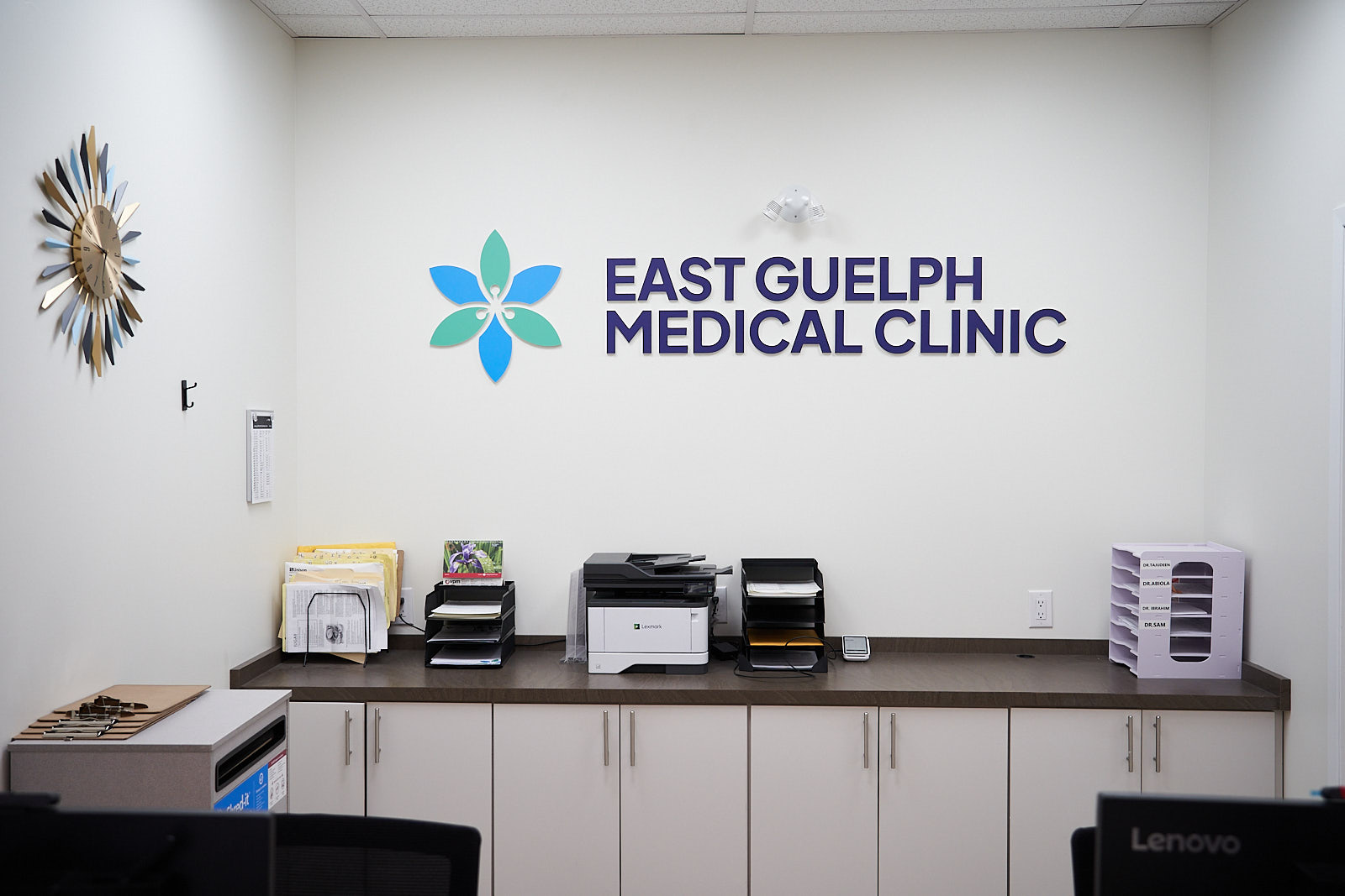 East Guelph Medical Clinic logo wall behind the administration desk