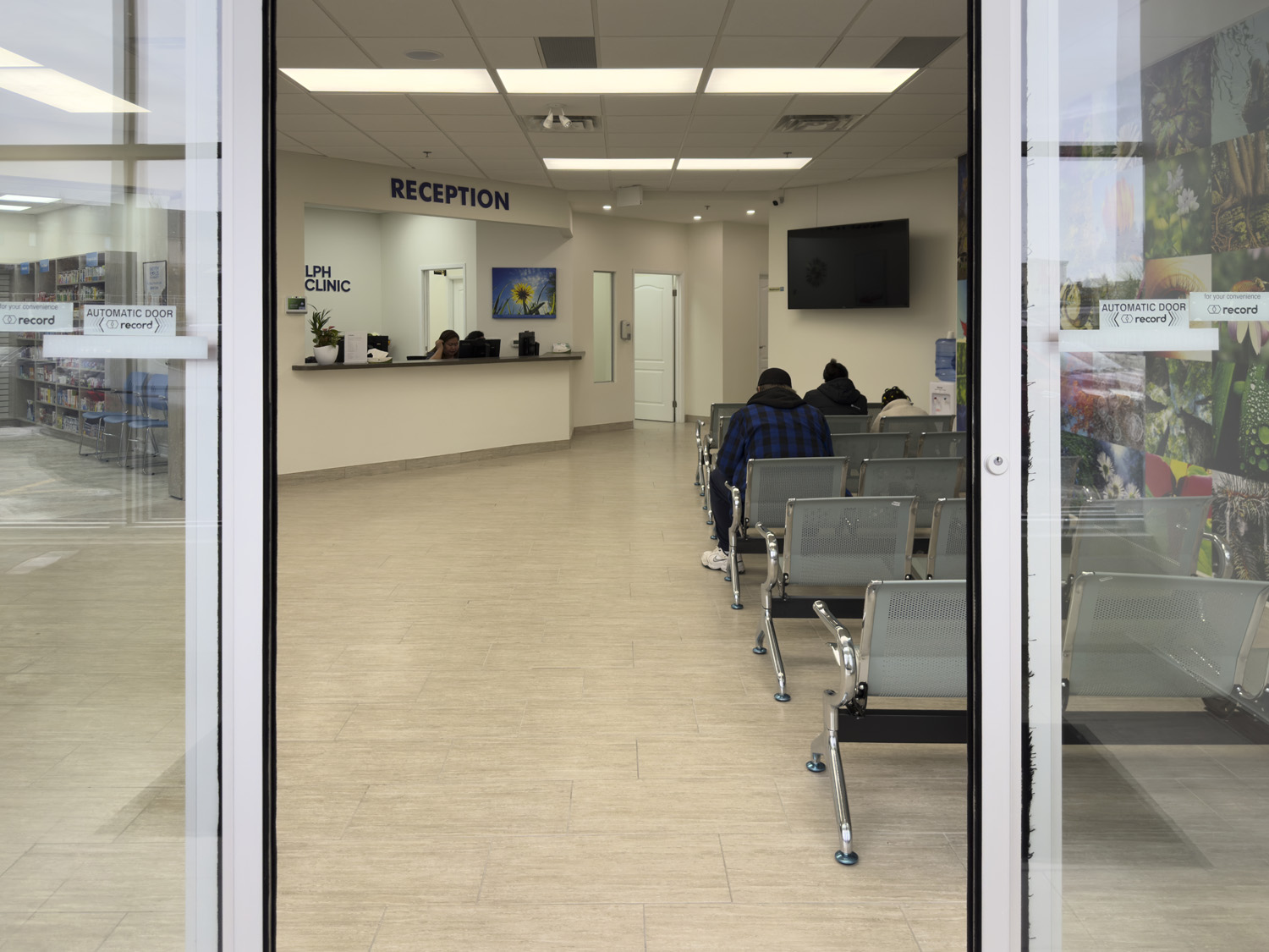 Patients seated in the waiting area near reception
